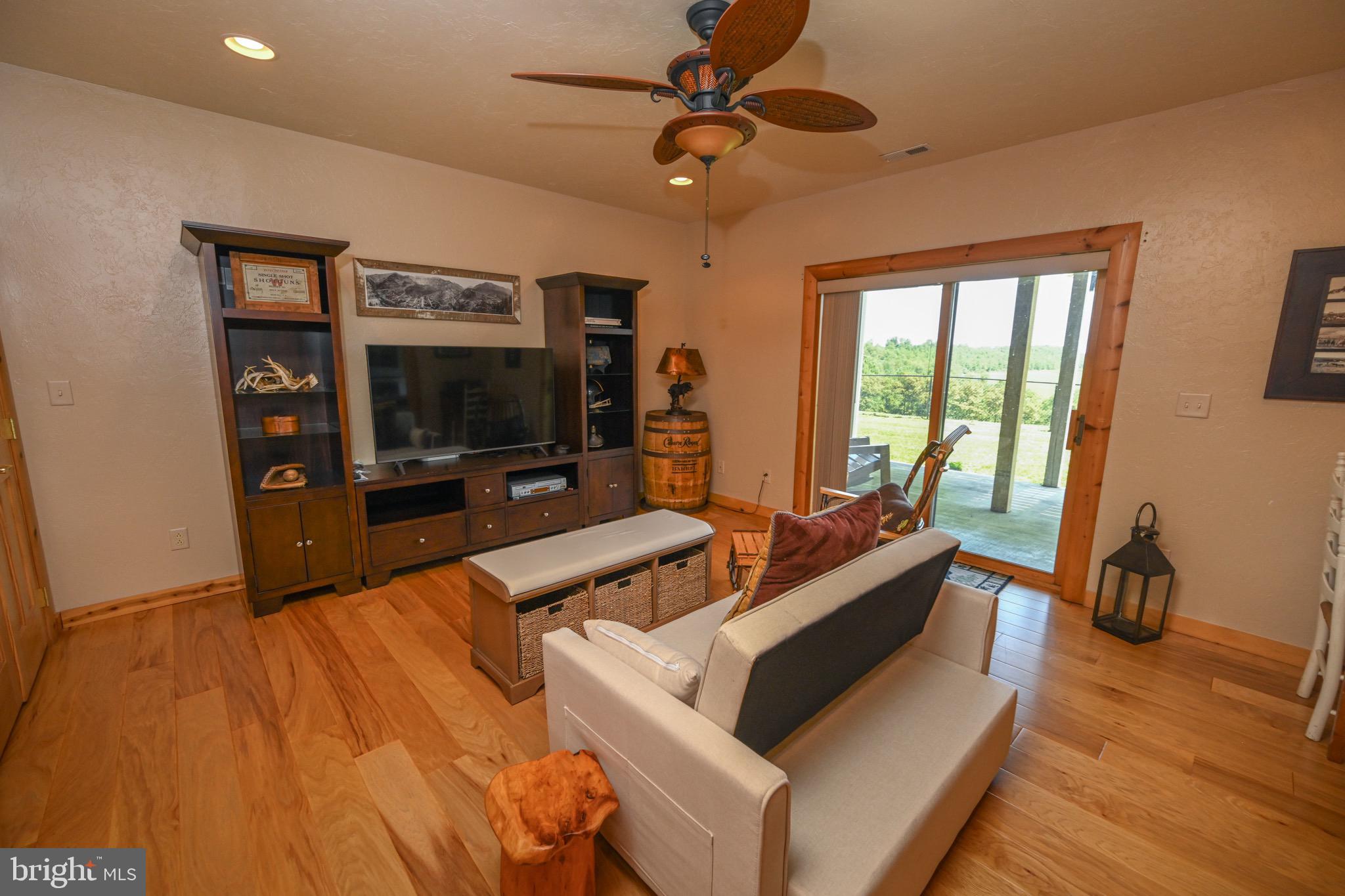 2325 Accident Friendsville Road Accident, MD 21520 - Photo 67 of 107 a living room with furniture and a flat screen tv