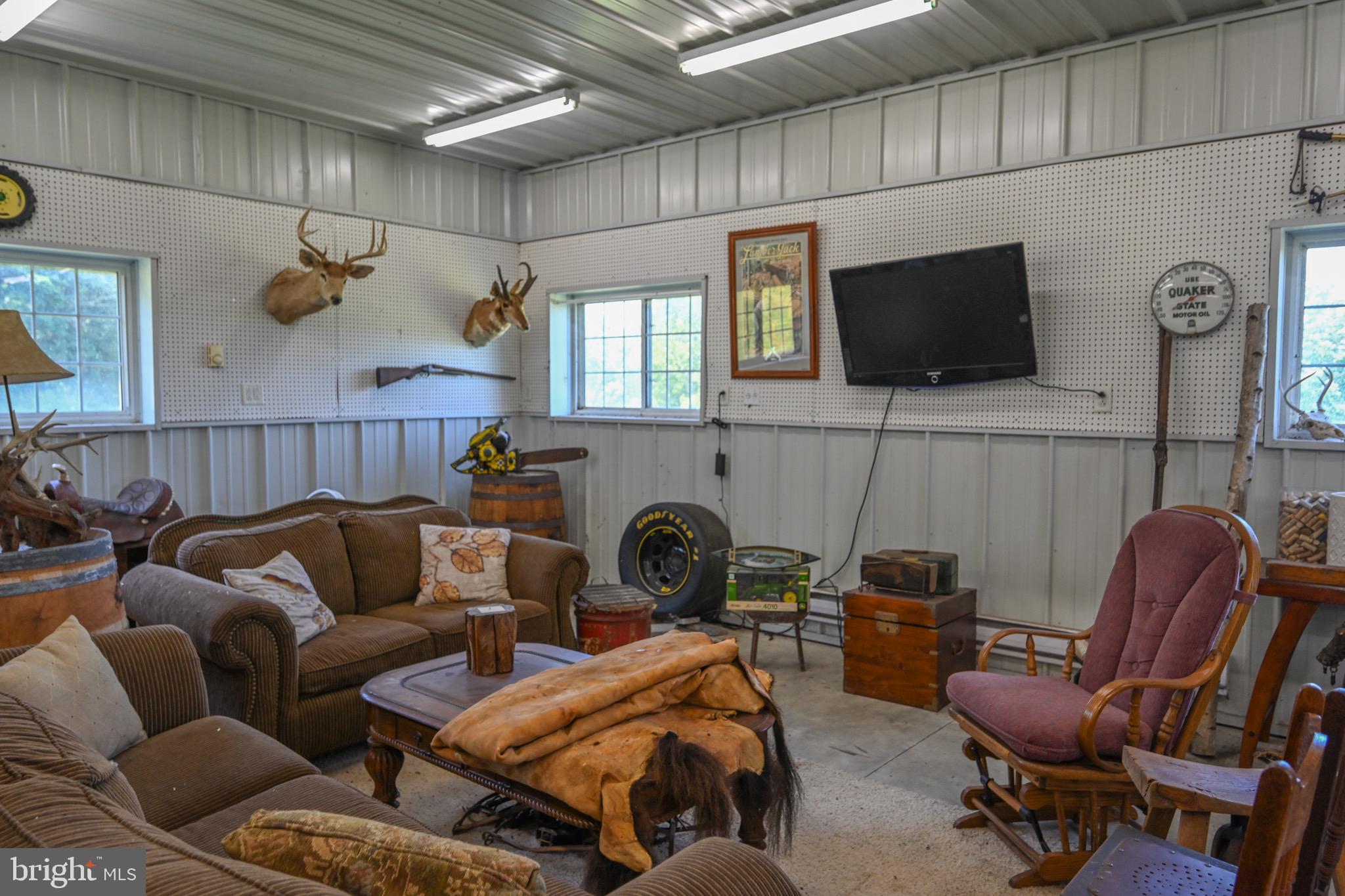 2325 Accident Friendsville Road Accident, MD 21520 - Photo 92 of 107 a bedroom with furniture and a flat screen tv