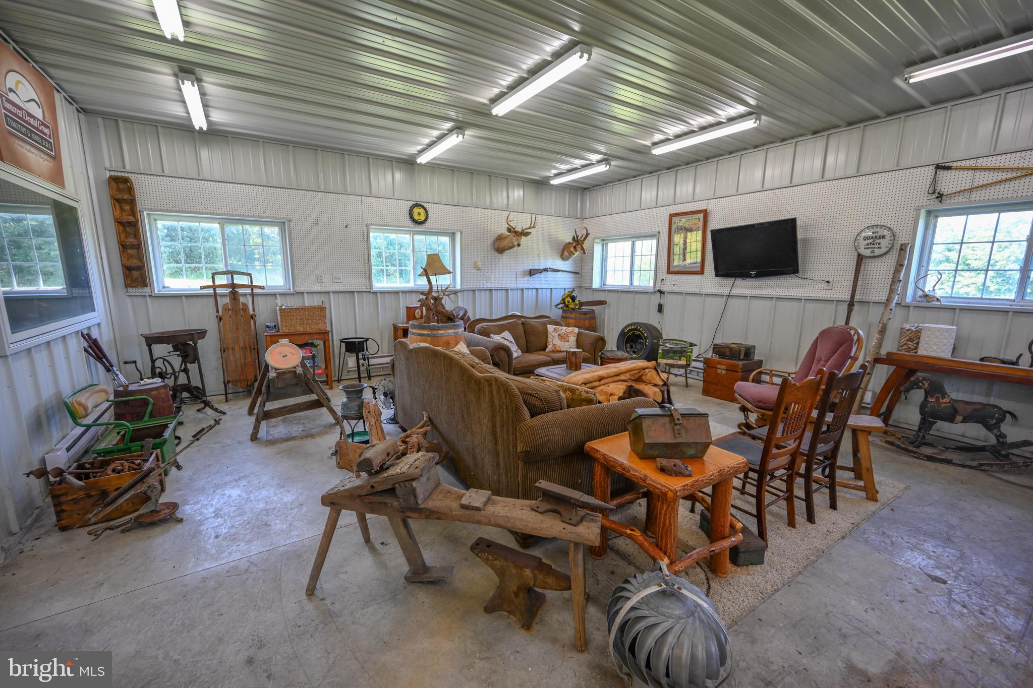 2325 Accident Friendsville Road Accident, MD 21520 - Photo 92 of 107 a living room with furniture and a flat screen tv