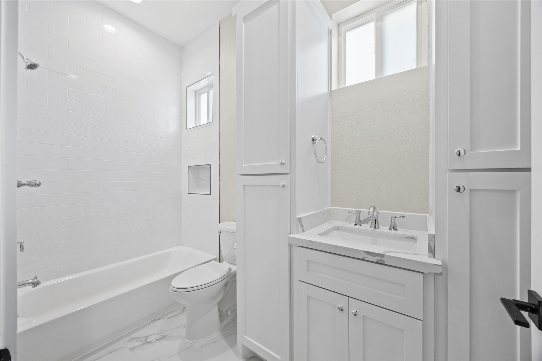 4384 Fiesta Lane Houston, TX 77004 - Photo 7 of 11 a bathroom with a granite countertop sink toilet and shower