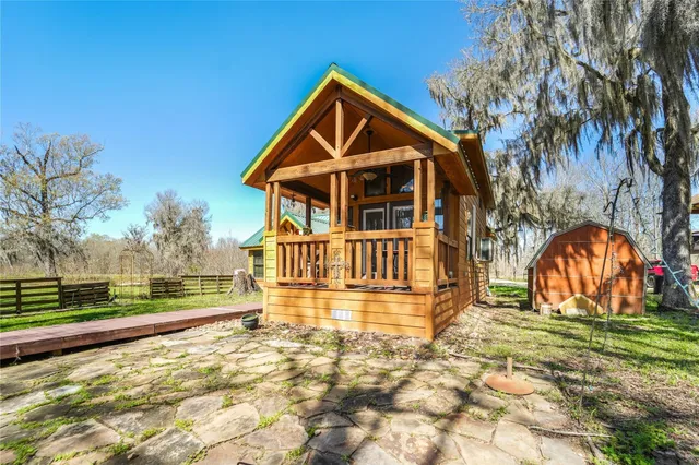 a view of house with a yard