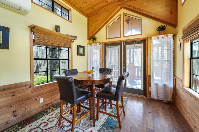 a view of a dining room with furniture and window