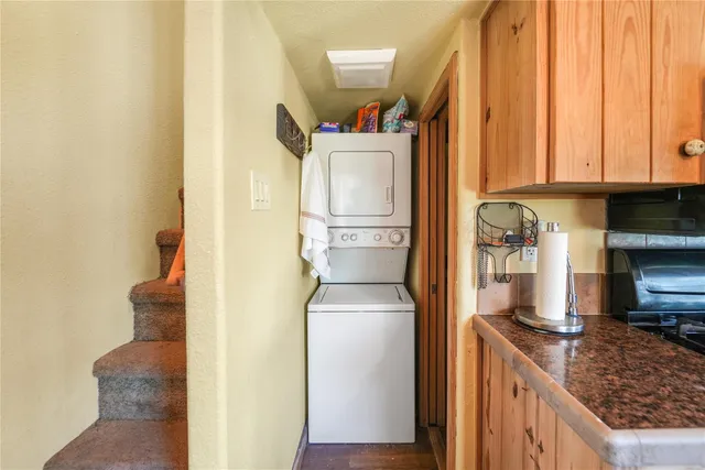 a kitchen with a refrigerator and a sink