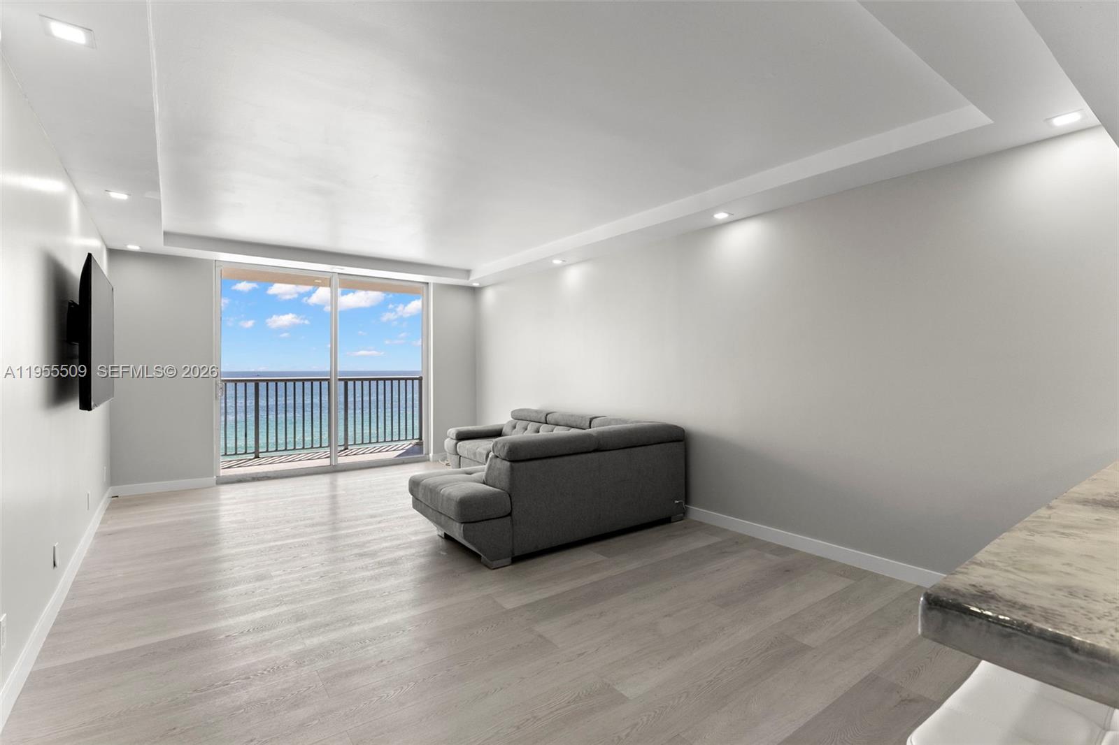 400 North Surf Road, Unit 903 Hollywood, FL 33019 - Photo 11 of 36 a living room with furniture and a large window