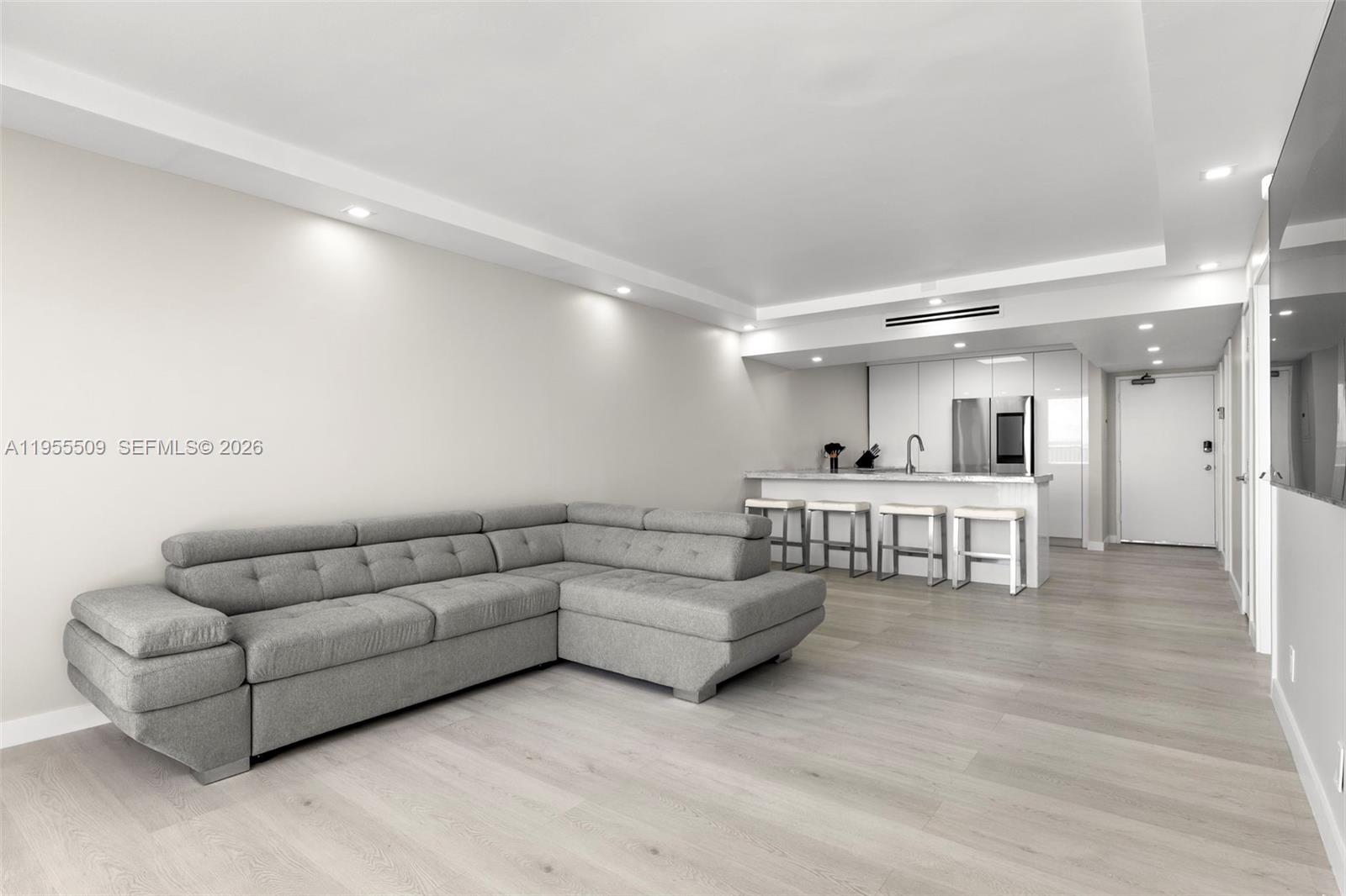 400 North Surf Road, Unit 903 Hollywood, FL 33019 - Photo 15 of 36 a living room with furniture and view of kitchen