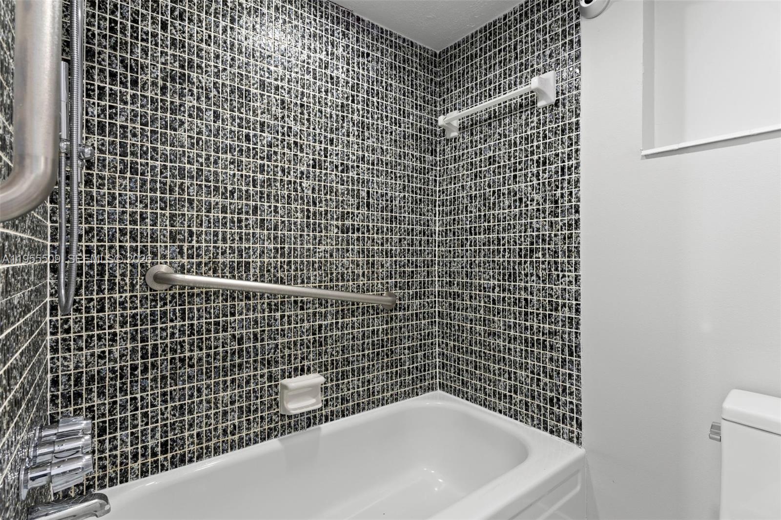 400 North Surf Road, Unit 903 Hollywood, FL 33019 - Photo 23 of 36 a bathroom with a bathtub