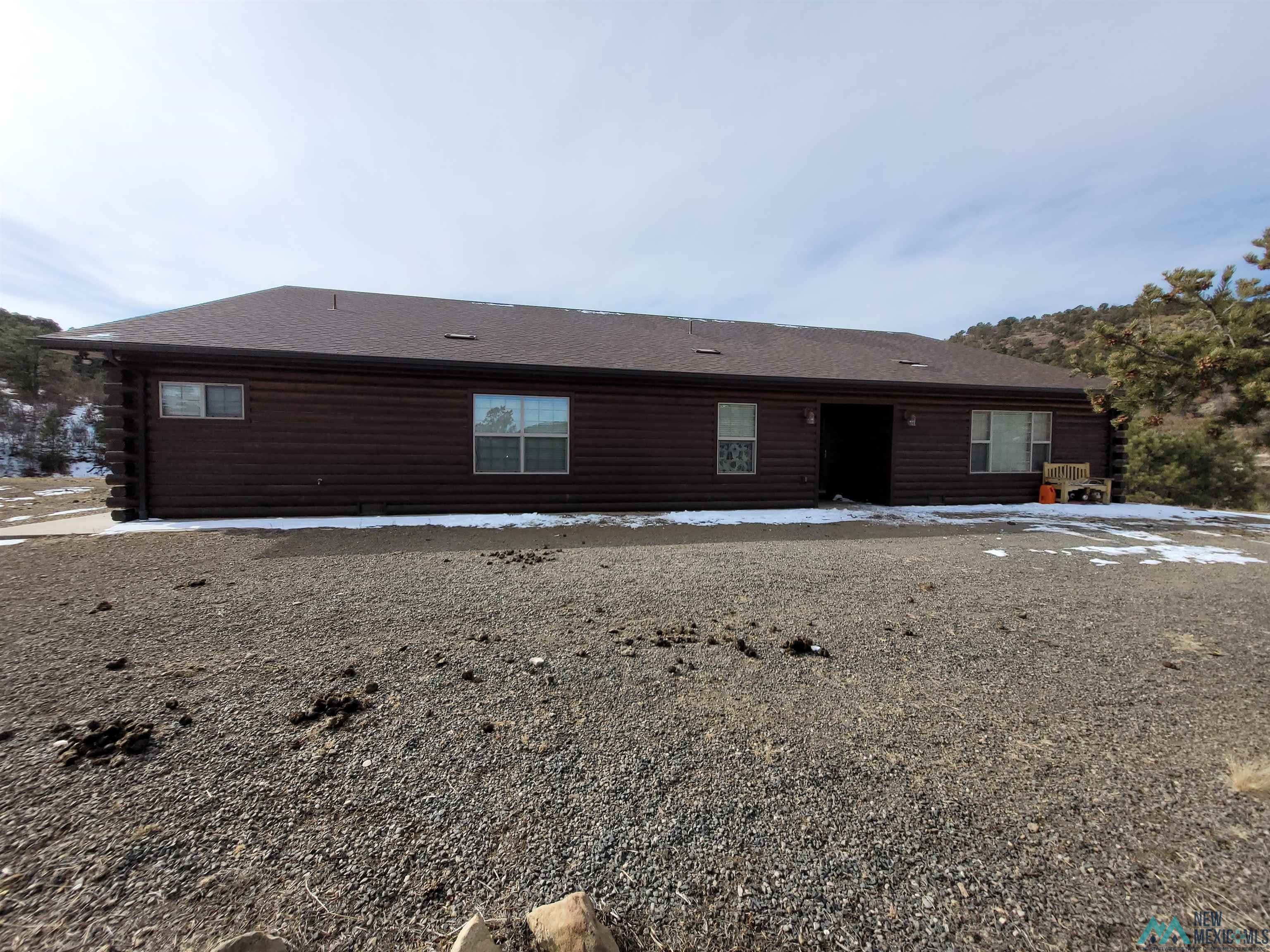 Front of house with log siding