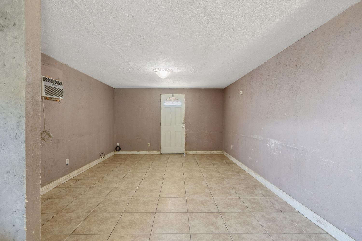 18309 Java Avenue Lemoore, CA 93245 - Photo 9 of 32 a view of an empty room with a window