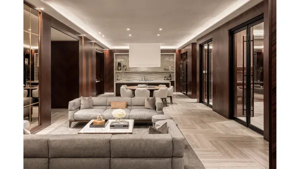 a room with stainless steel appliances kitchen island granite countertop a dining table and chairs