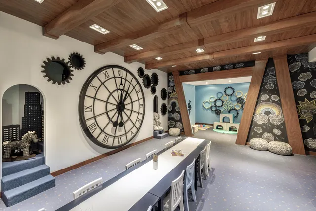 a view of a patio with table and chairs and potted plants