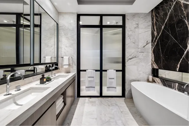 a bathroom with a bathtub and shower