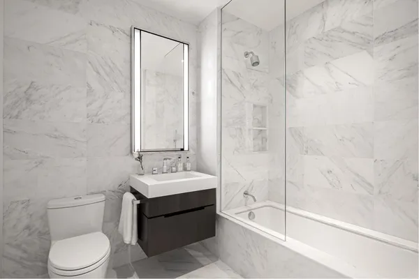 a bathroom with a bathtub and shower
