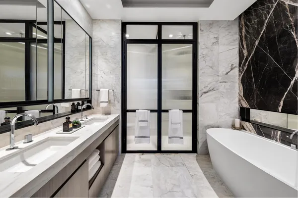 a bathroom with a sink a toilet and bathtub