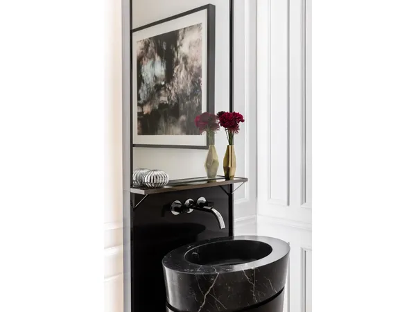 a bathroom with a double vanity sink a bathtub and next to a window