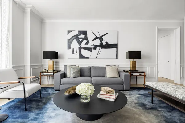 a picture of a room with a fireplace and dining table