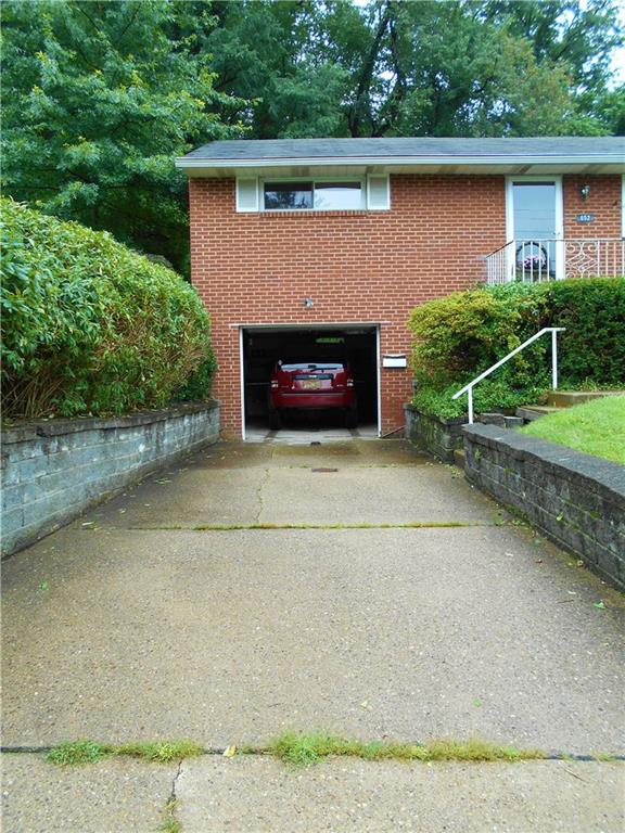 652 Filmore Road Pittsburgh, PA 15221 - Photo 3 of 24 Plenty of room in the garage for an SUV, and also room to stack two more cars in the driveway.