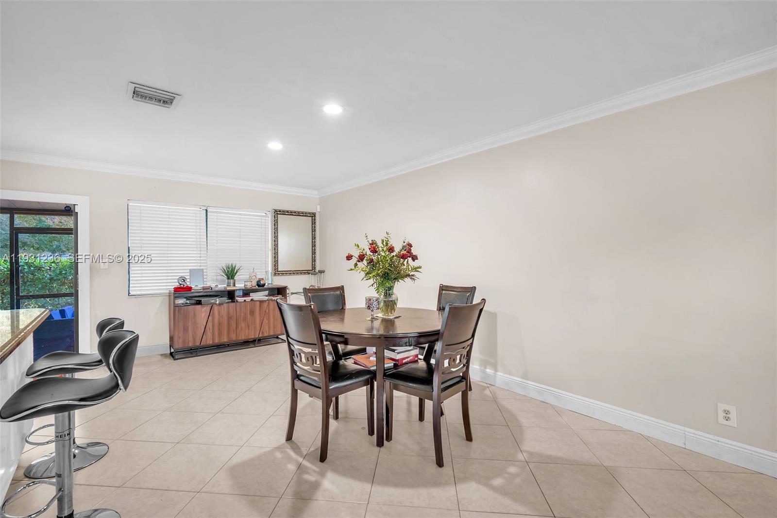 3370 Beau Rivage Drive, Unit 3N Pompano Beach, FL 33064 - Photo 14 of 38 a view of a dining room with furniture