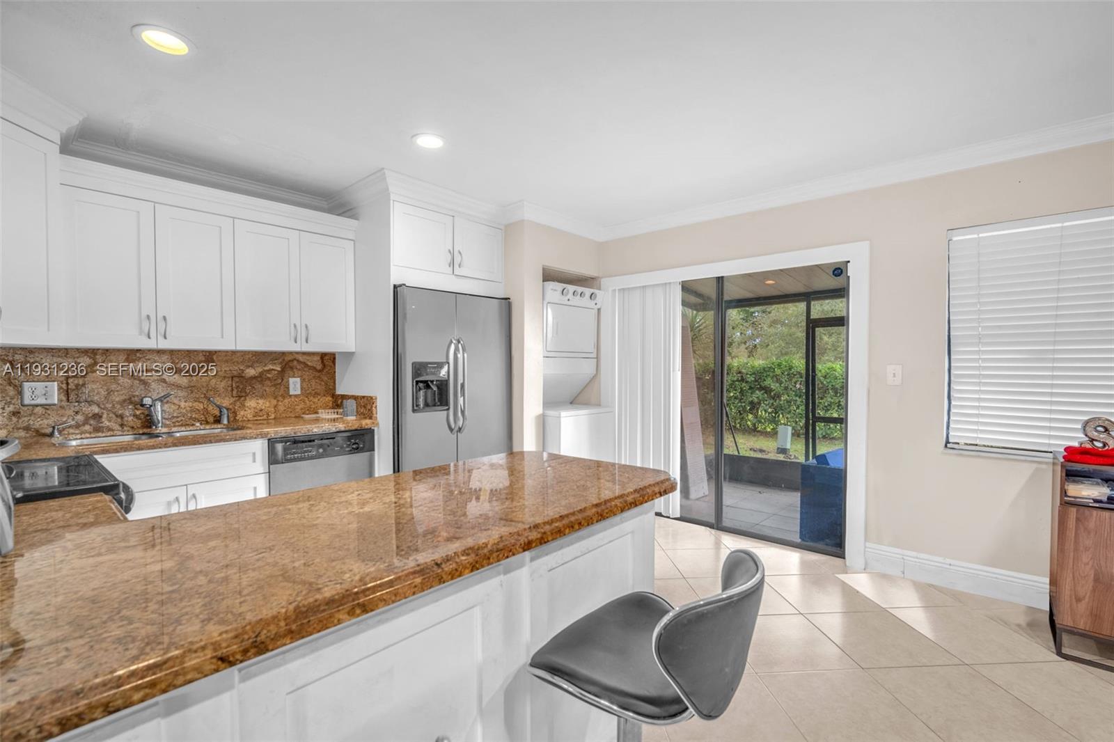 3370 Beau Rivage Drive, Unit 3N Pompano Beach, FL 33064 - Photo 18 of 38 a kitchen with granite countertop a sink and a counter top space