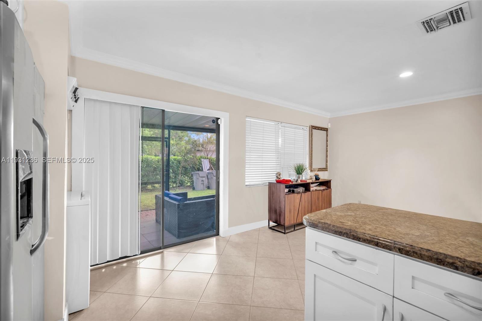 3370 Beau Rivage Drive, Unit 3N Pompano Beach, FL 33064 - Photo 24 of 38 a kitchen with stainless steel appliances granite countertop a refrigerator and a sink