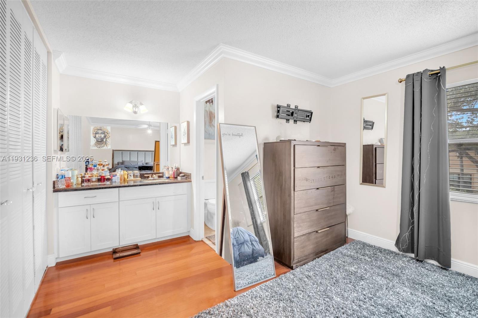 3370 Beau Rivage Drive, Unit 3N Pompano Beach, FL 33064 - Photo 29 of 38 a room with a refrigerator and a dresser