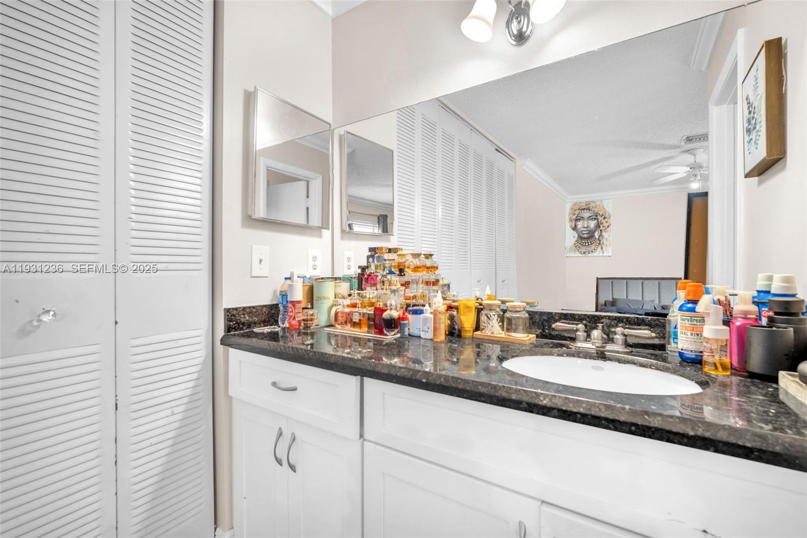3370 Beau Rivage Drive, Unit 3N Pompano Beach, FL 33064 - Photo 30 of 38 a bathroom with sink and mirror