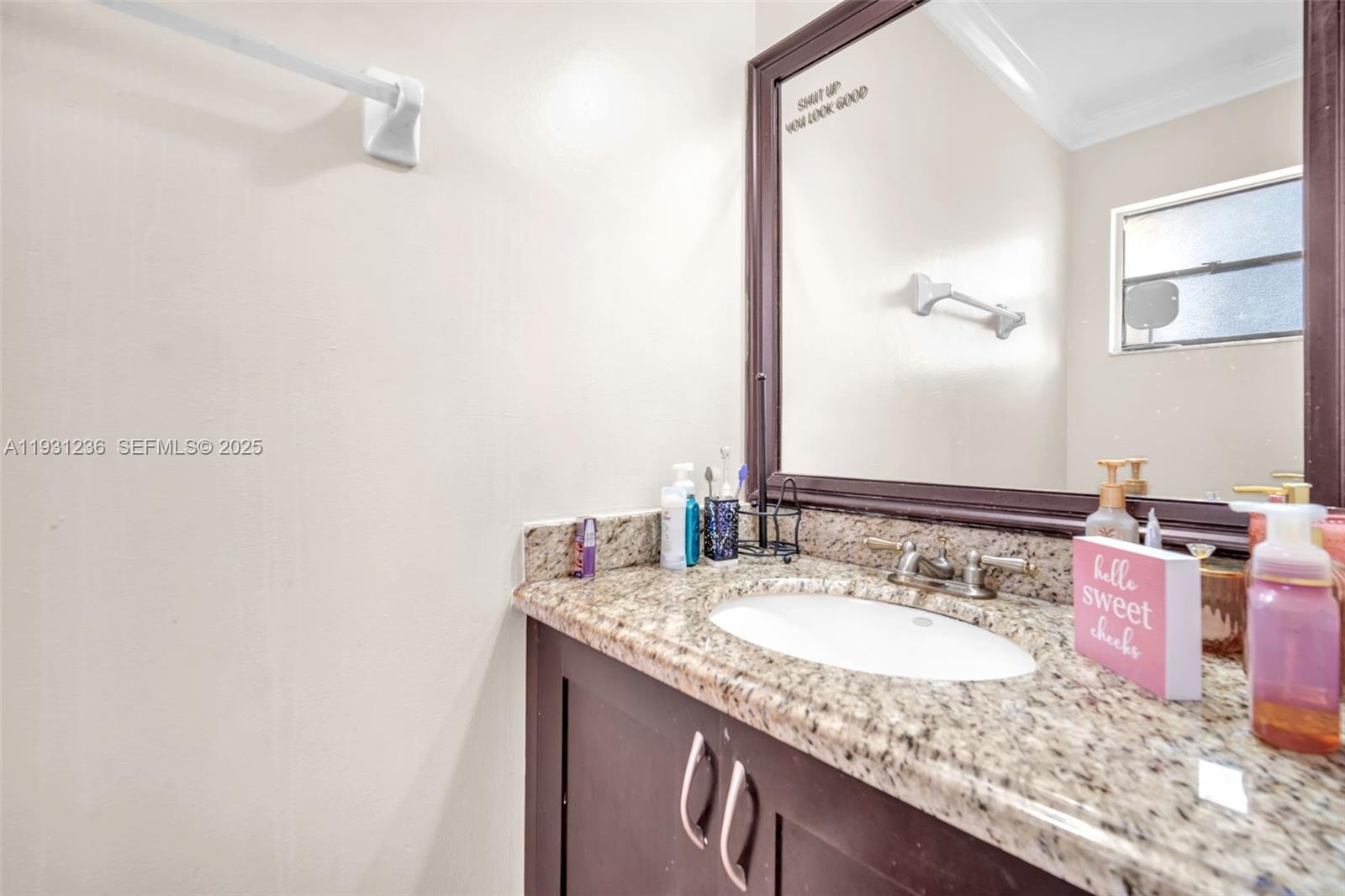 3370 Beau Rivage Drive, Unit 3N Pompano Beach, FL 33064 - Photo 33 of 38 a bathroom with a granite countertop sink and a mirror