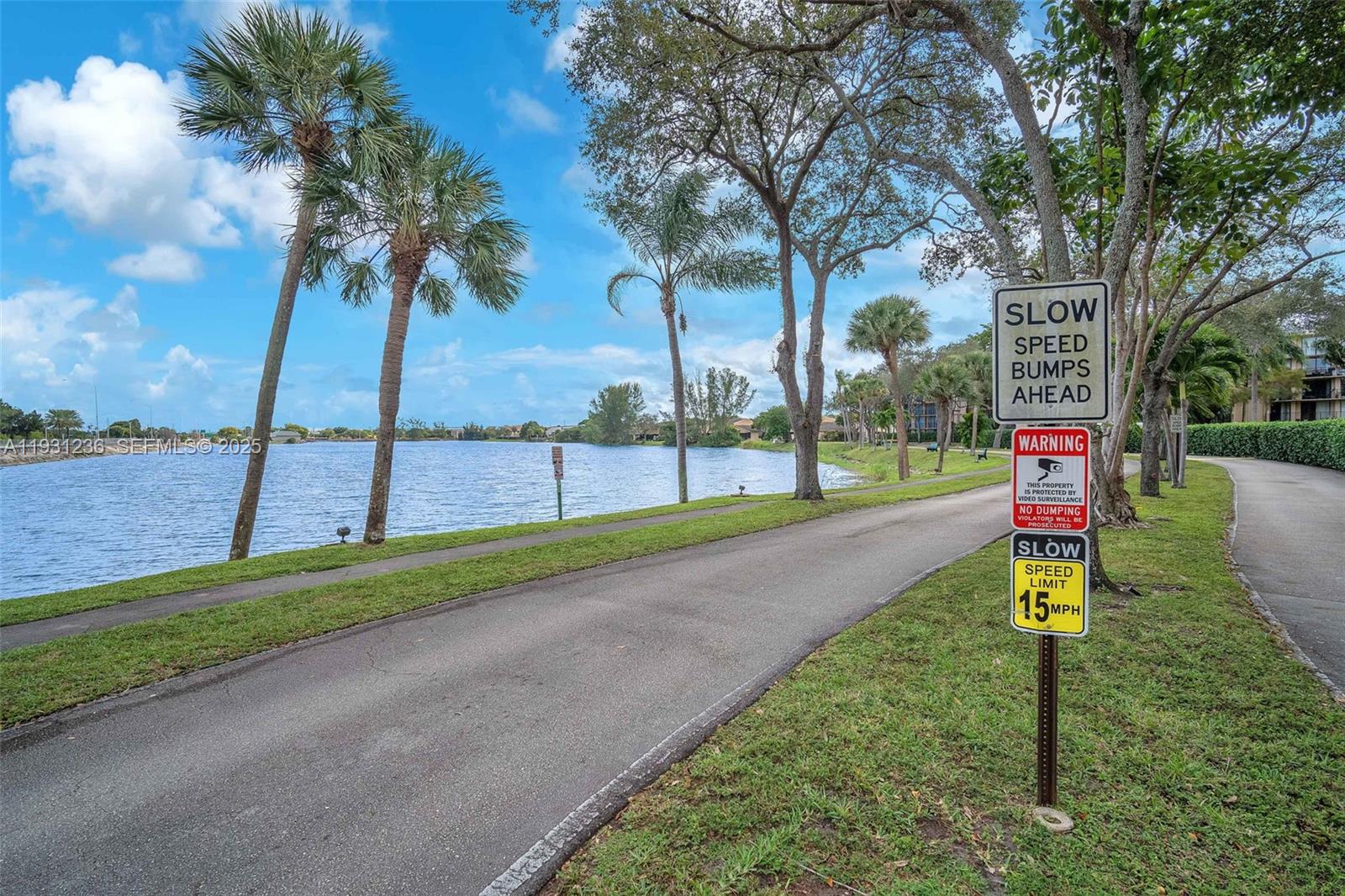 3370 Beau Rivage Drive, Unit 3N Pompano Beach, FL 33064 - Photo 38 of 38 a park with tall trees