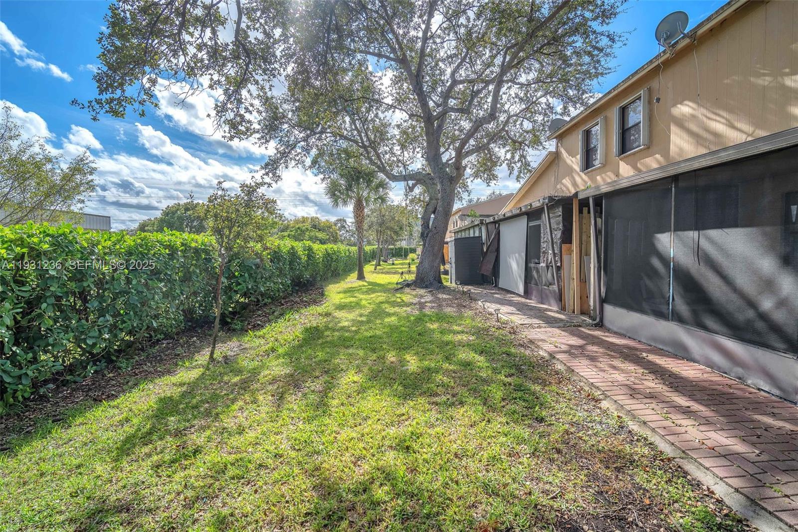 3370 Beau Rivage Drive, Unit 3N Pompano Beach, FL 33064 - Photo 6 of 38 a view of a house with a yard