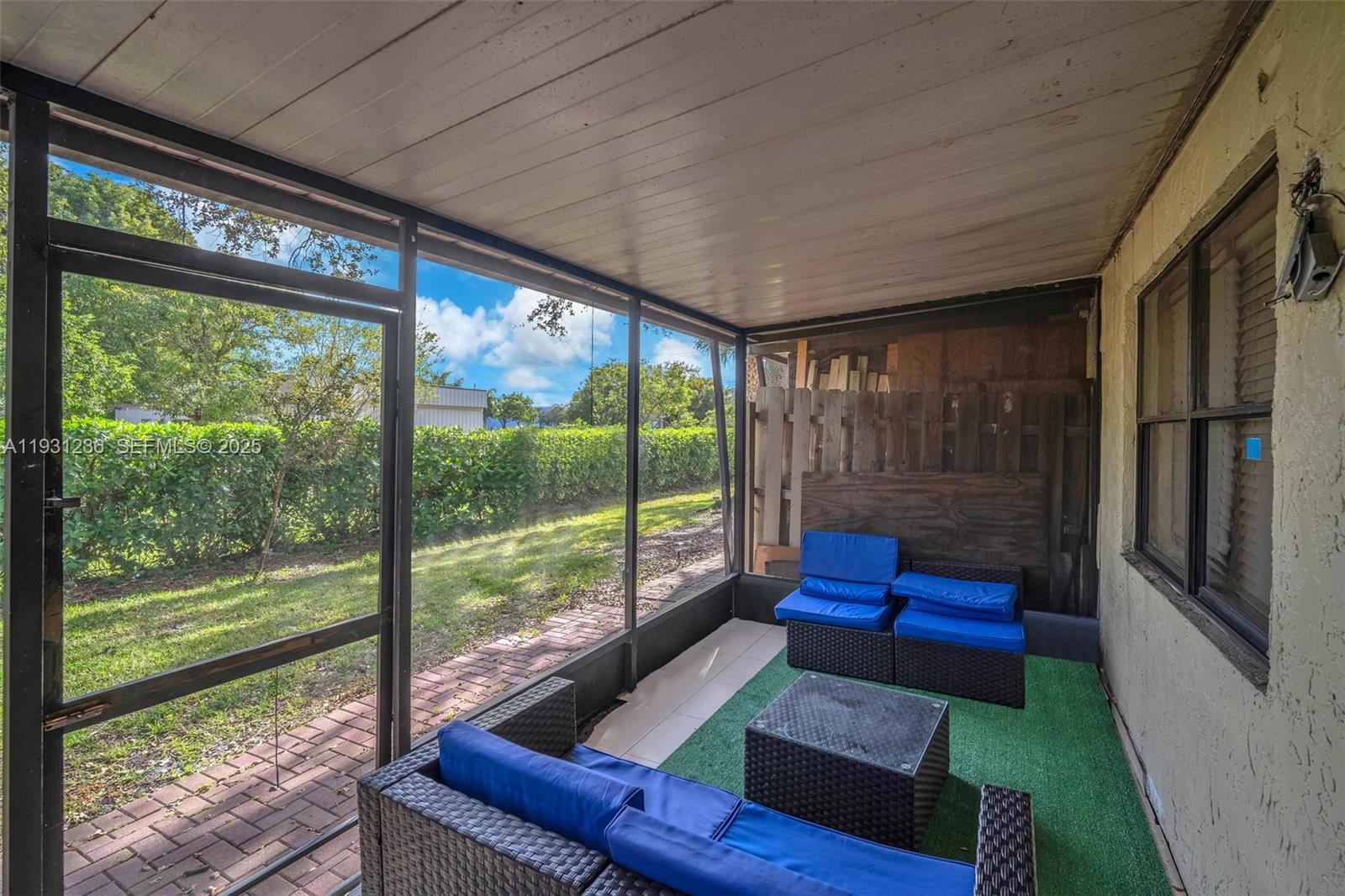 3370 Beau Rivage Drive, Unit 3N Pompano Beach, FL 33064 - Photo 7 of 38 a living room with couch and a floor to ceiling window
