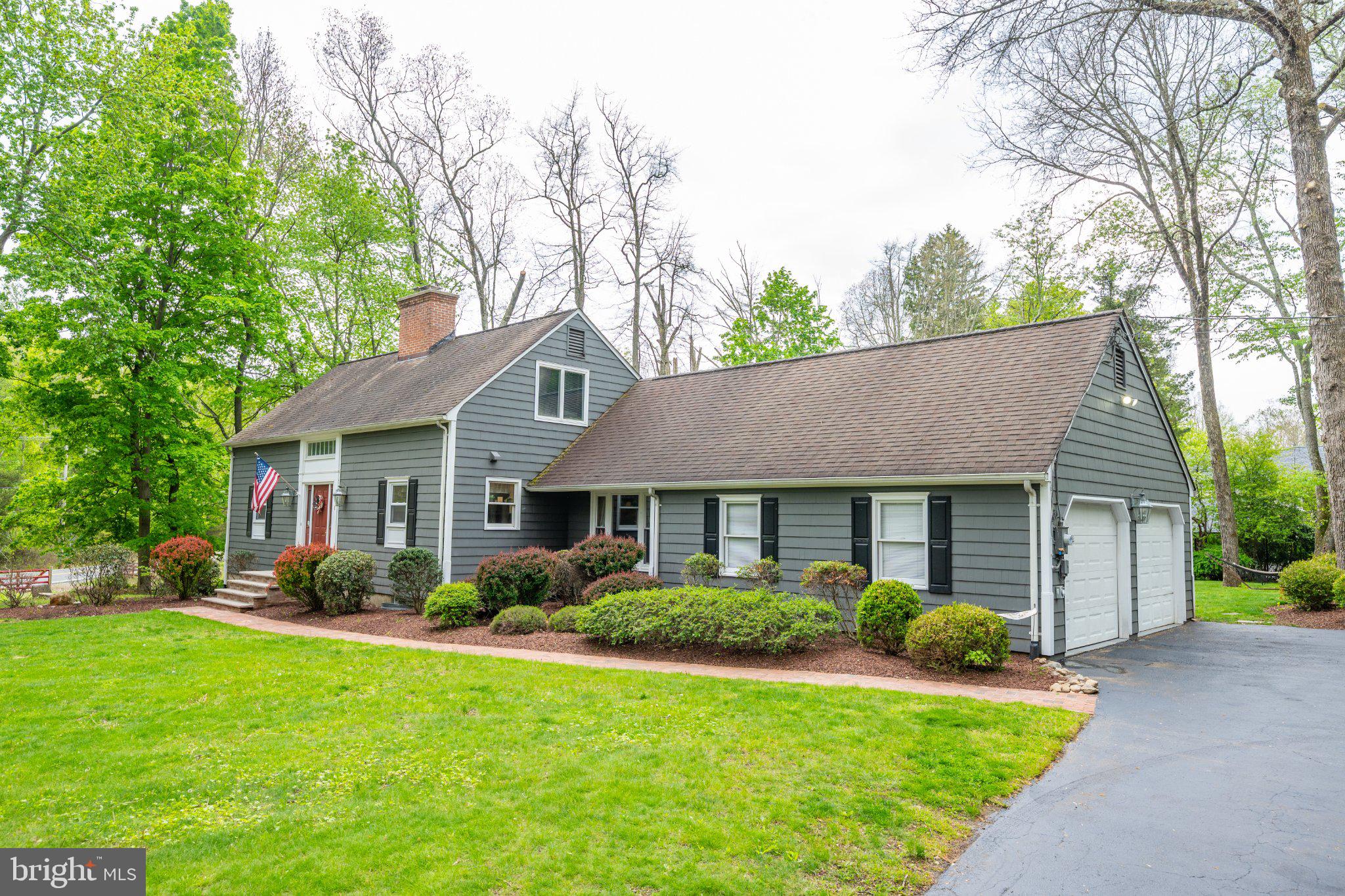 Charming home with lush greenery.