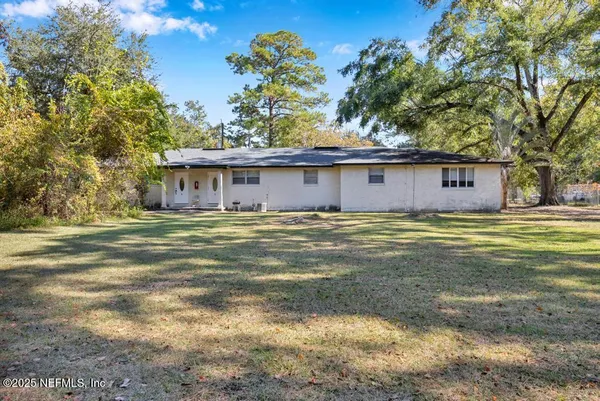 a view of a house with a big yard