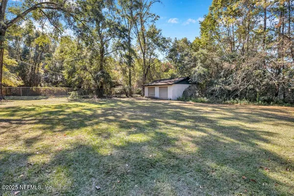 a swimming pool is in the middle of a yard