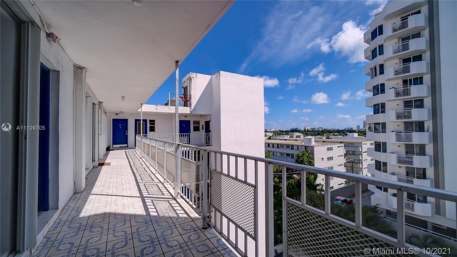 1340 Lincoln Road, Unit 806 Miami Beach, FL 33139 - Photo 2 of 48 a view of a balcony with wooden floor and fence