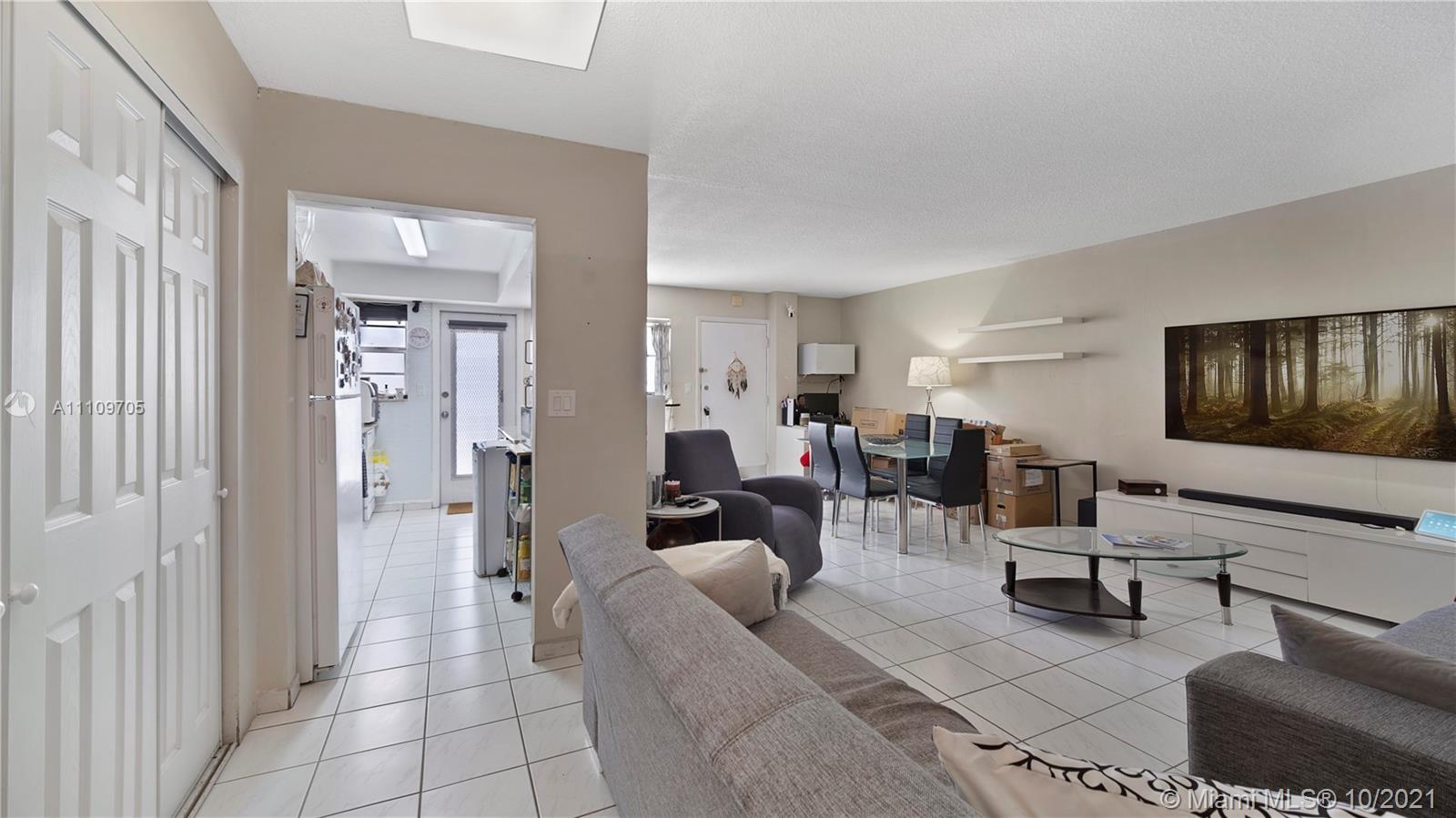 1340 Lincoln Road, Unit 806 Miami Beach, FL 33139 - Photo 14 of 48 a living room with furniture and a flat screen tv