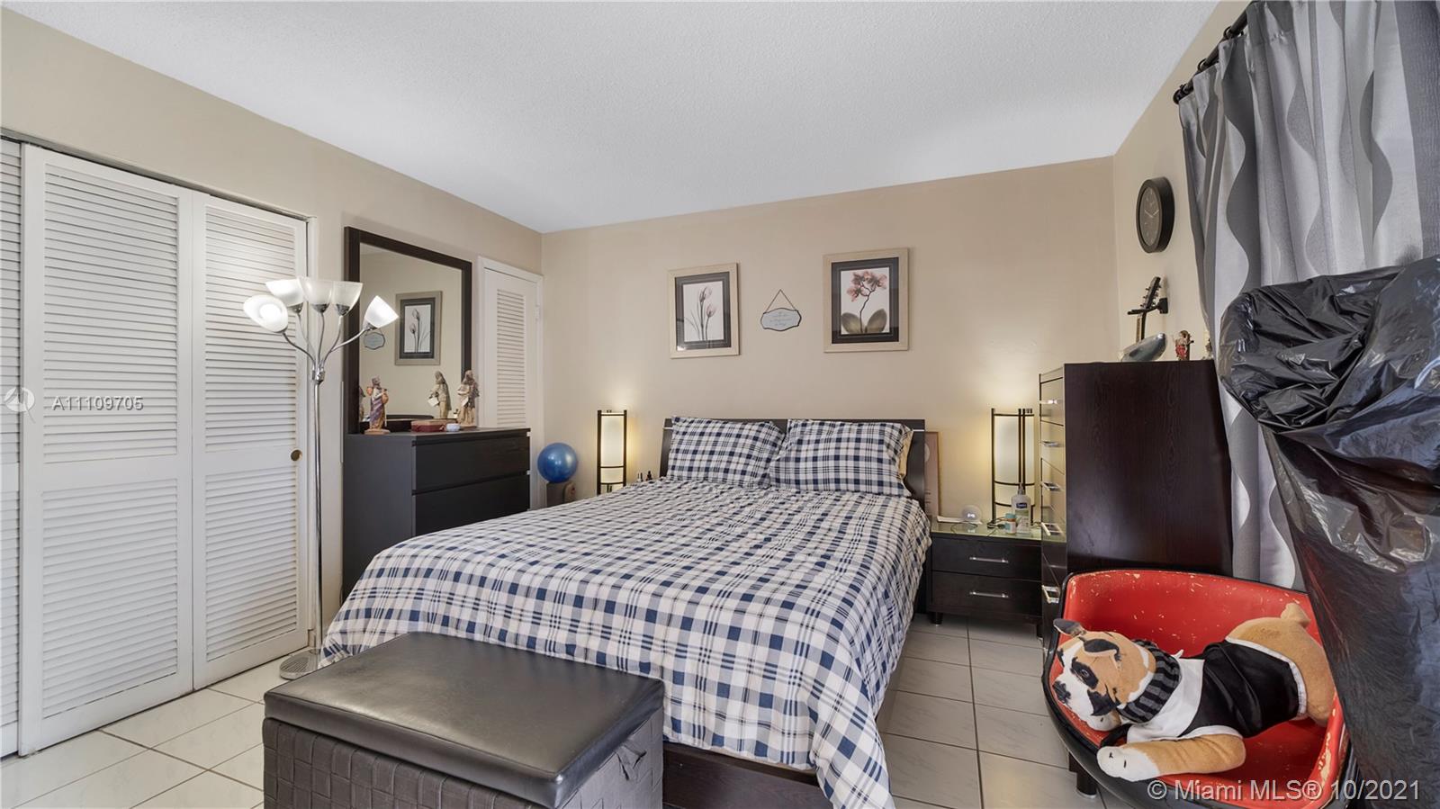 1340 Lincoln Road, Unit 806 Miami Beach, FL 33139 - Photo 18 of 48 a bedroom with a bed and dresser