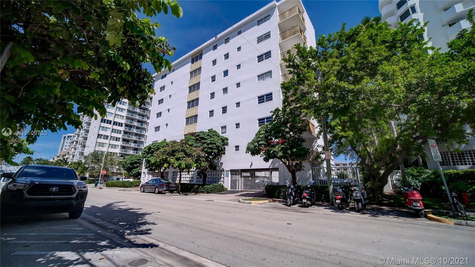 1340 Lincoln Road, Unit 806 Miami Beach, FL 33139 - Photo 38 of 48 a car parked in front of a building