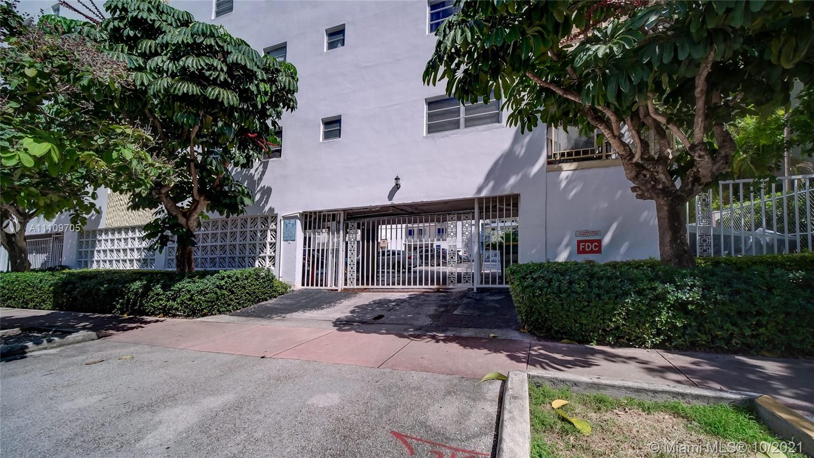 1340 Lincoln Road, Unit 806 Miami Beach, FL 33139 - Photo 39 of 48 a front view of a house with a yard and a garden