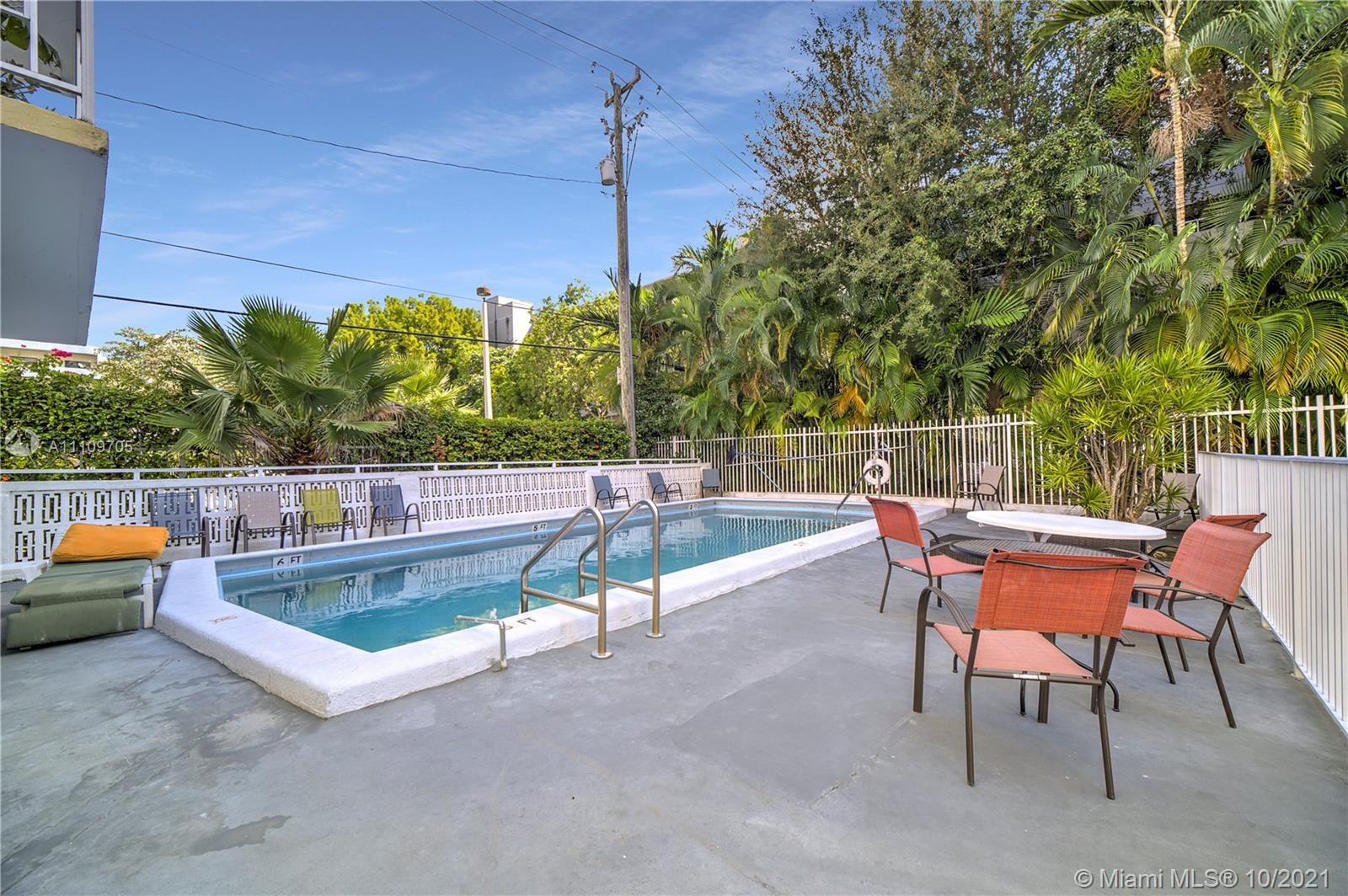 1340 Lincoln Road, Unit 806 Miami Beach, FL 33139 - Photo 48 of 48 a view of a chairs and table in the back yard of the house