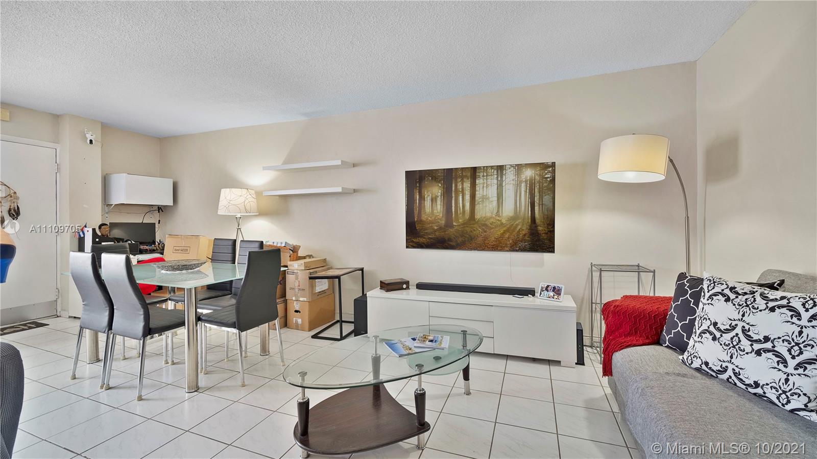 1340 Lincoln Road, Unit 806 Miami Beach, FL 33139 - Photo 8 of 48 a living room with furniture and a view of kitchen