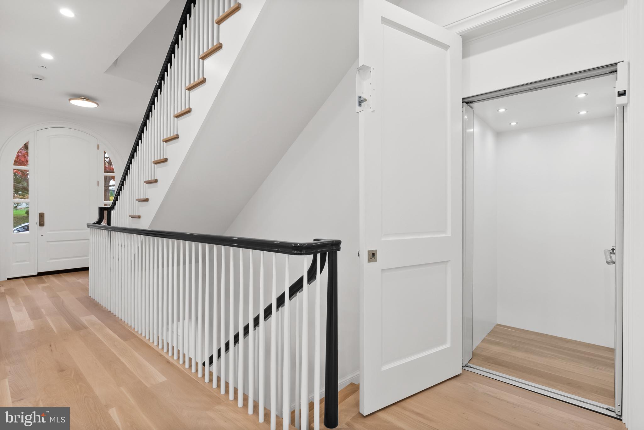 4905 Van Ness Street Northwest Washington, DC 20016 - Photo 15 of 27 a view of a hallway with stairs