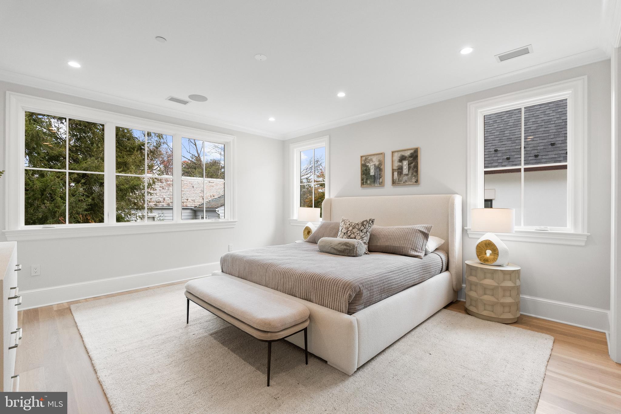 4905 Van Ness Street Northwest Washington, DC 20016 - Photo 16 of 27 a spacious bedroom with a bed and a large window