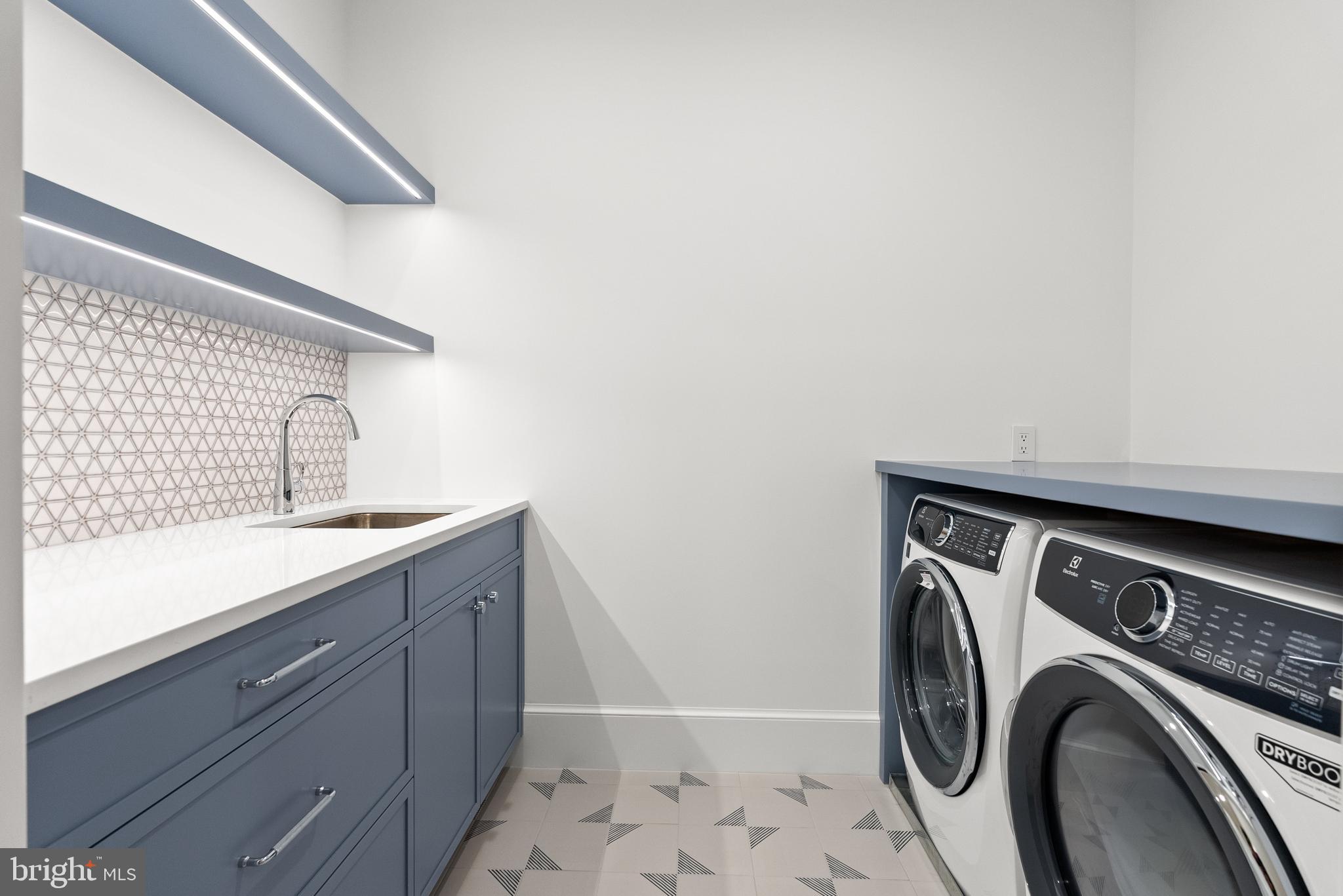 4905 Van Ness Street Northwest Washington, DC 20016 - Photo 21 of 27 a utility room with dryer and washer