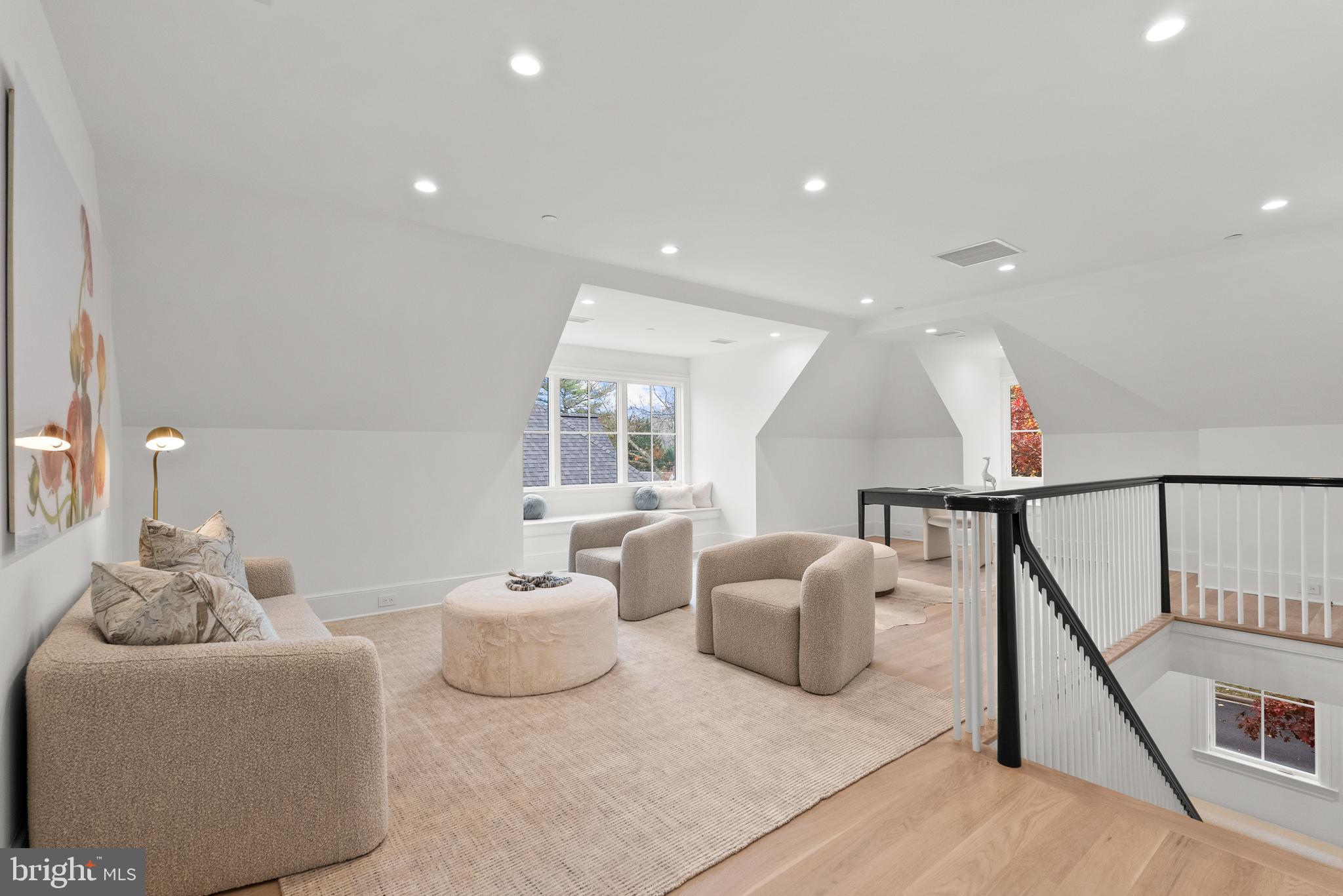 4905 Van Ness Street Northwest Washington, DC 20016 - Photo 22 of 27 a living room with furniture and a table