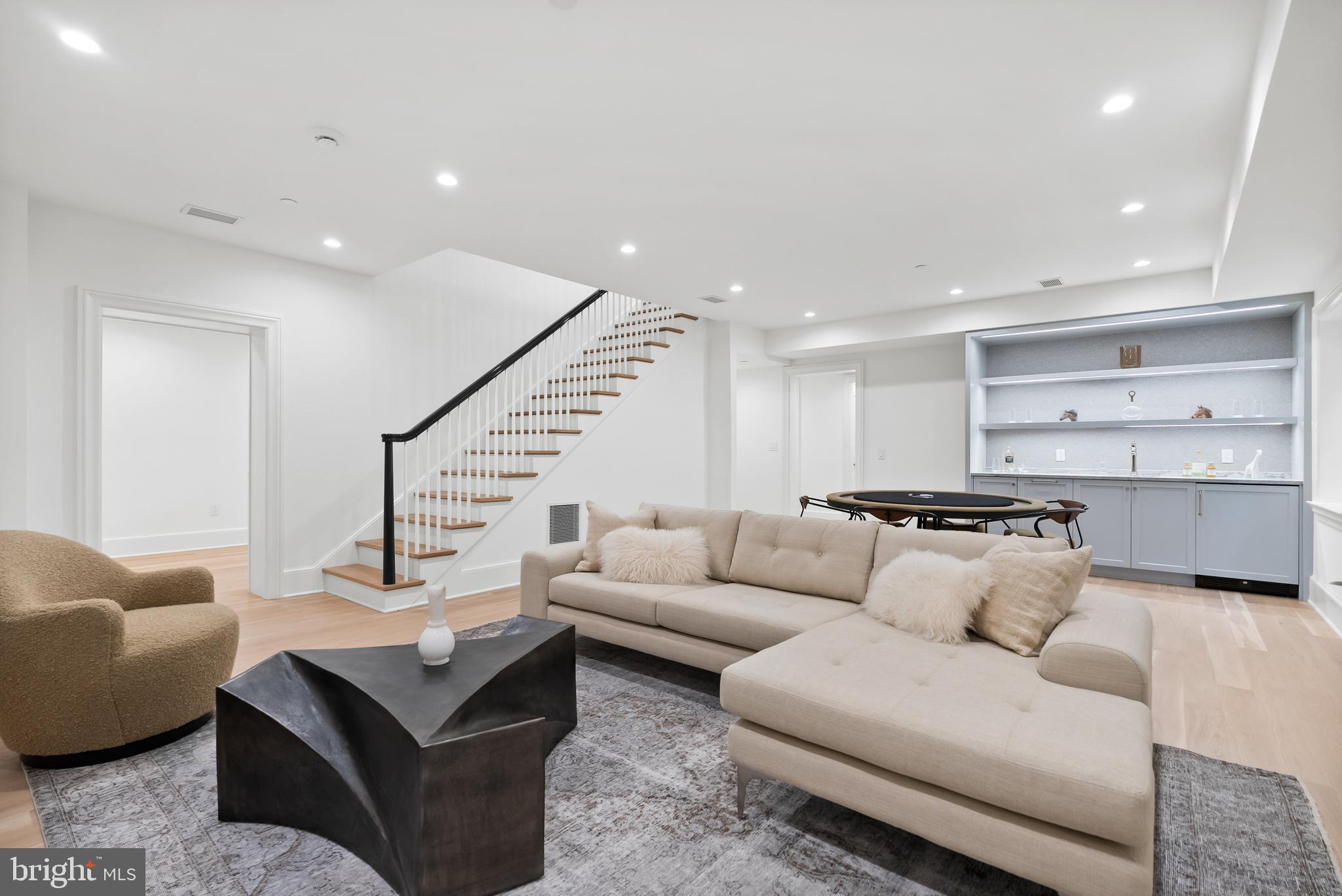 4905 Van Ness Street Northwest Washington, DC 20016 - Photo 25 of 27 a living room with furniture kitchen view and a couch