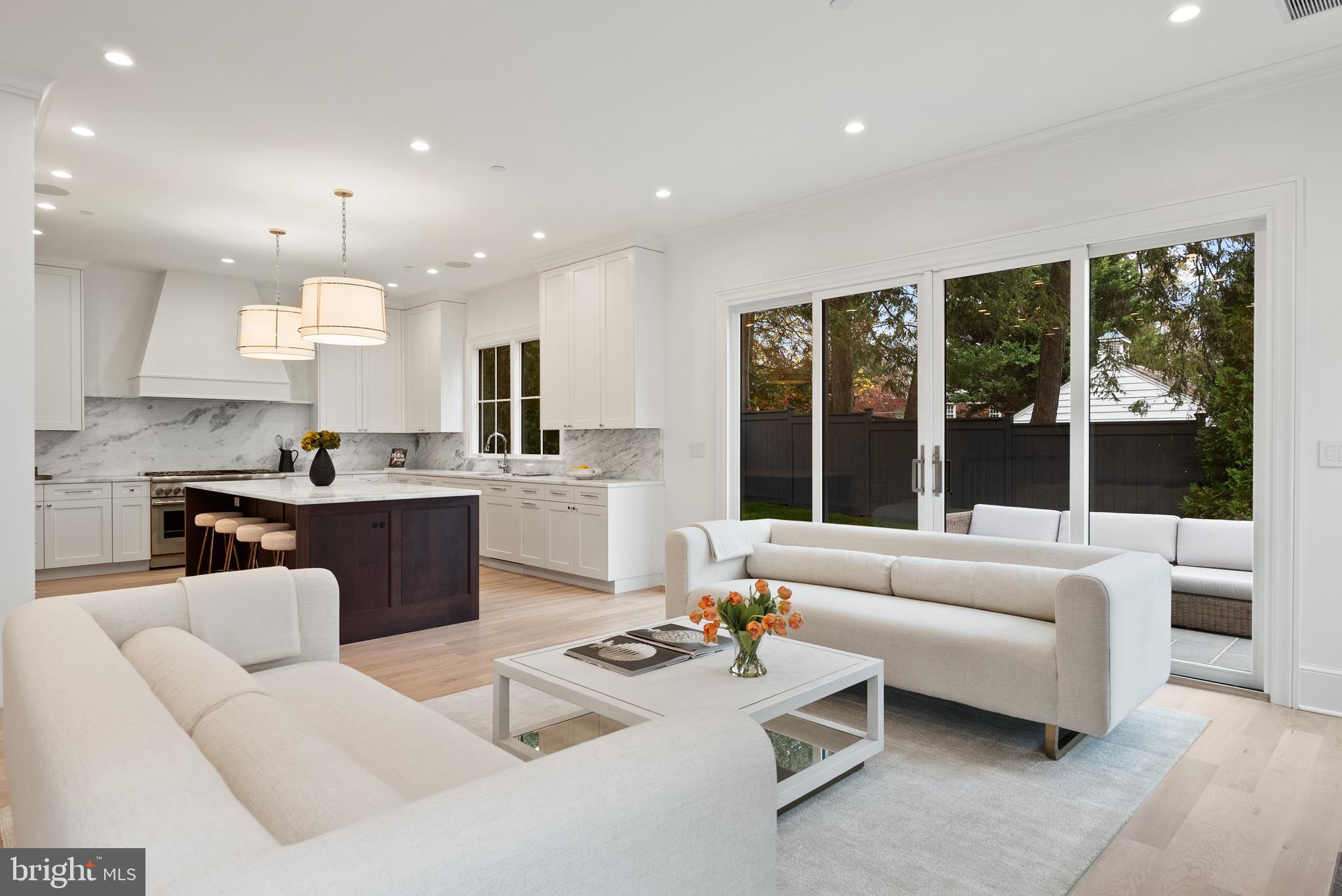 4905 Van Ness Street Northwest Washington, DC 20016 - Photo 3 of 27 a living room with furniture and a large window