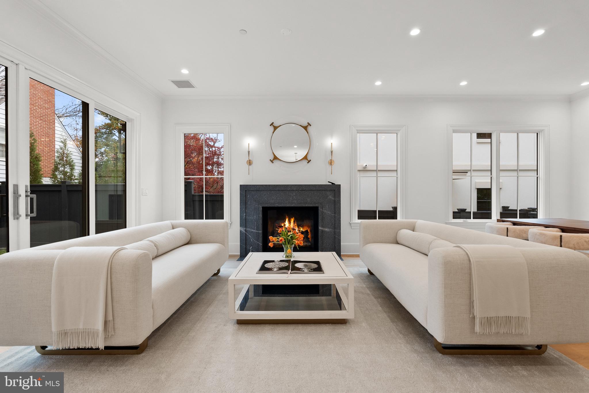 4905 Van Ness Street Northwest Washington, DC 20016 - Photo 7 of 27 a living room with furniture and a fireplace