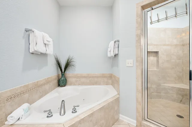 a view of a two chairs in the balcony