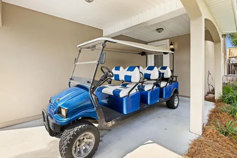 a kitchen with stainless steel appliances granite countertop a stove top oven a sink dishwasher a dining table and chairs with wooden floor