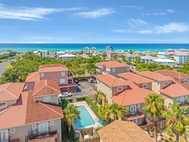 a swimming pool with outdoor seating and yard
