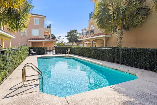 a view of a swimming pool with a patio